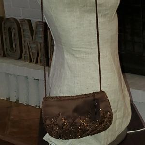 Stunning satin brown hand beaded rope purse.